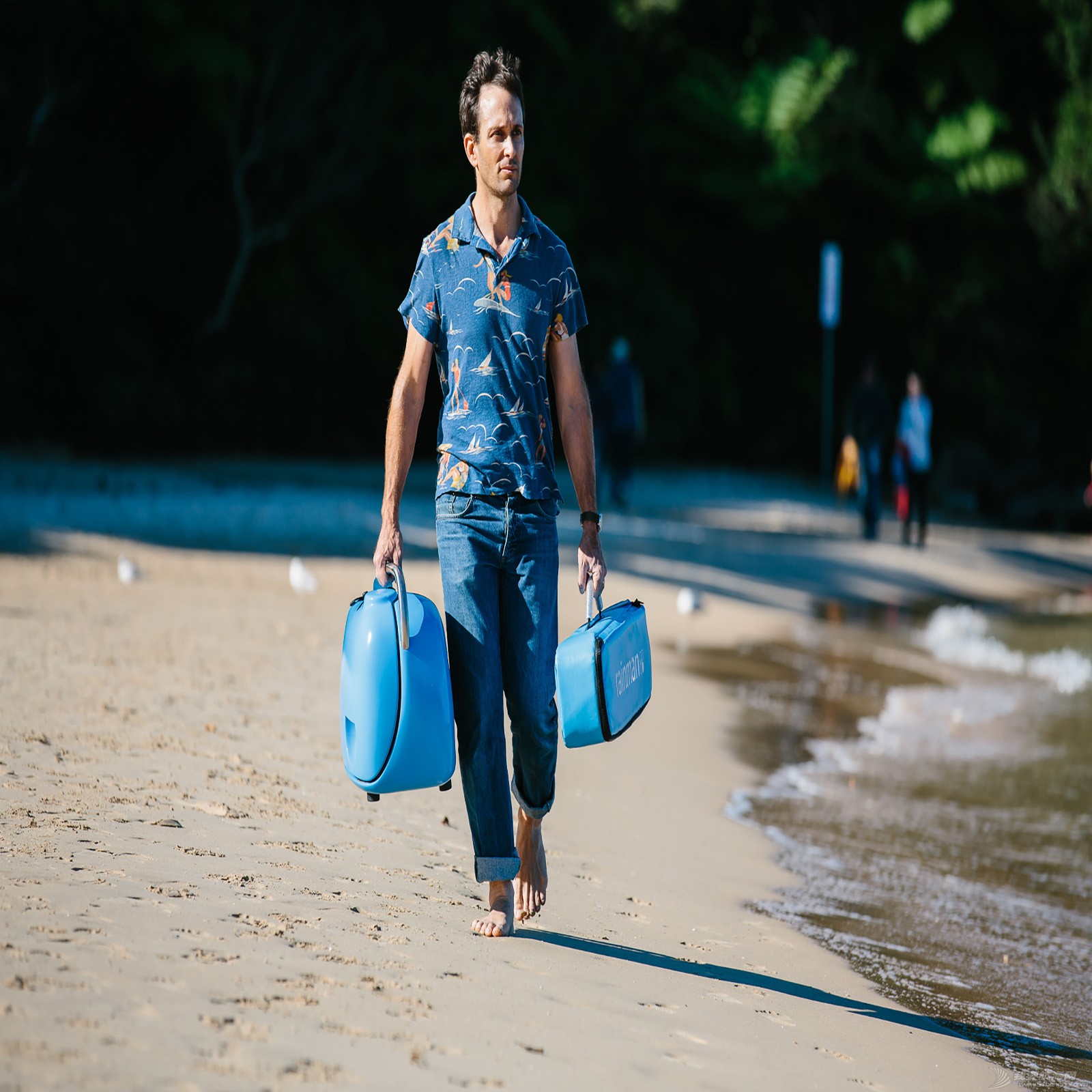 Rainman walking on beach.jpg